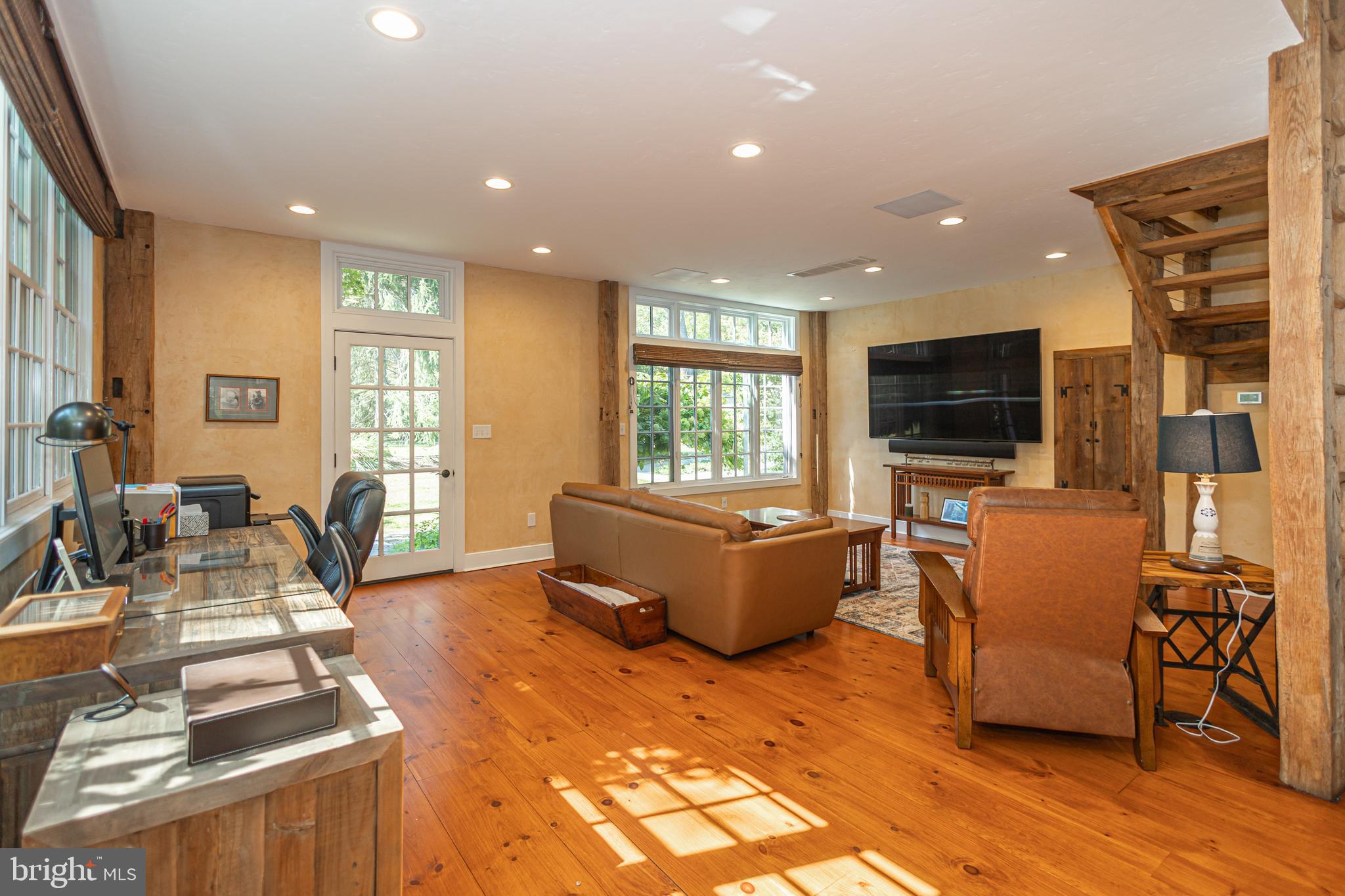 928 Taylorsville Road Washington Crossing, PA 18977 - Photo 55 of 106 a living room with furniture and a flat screen tv