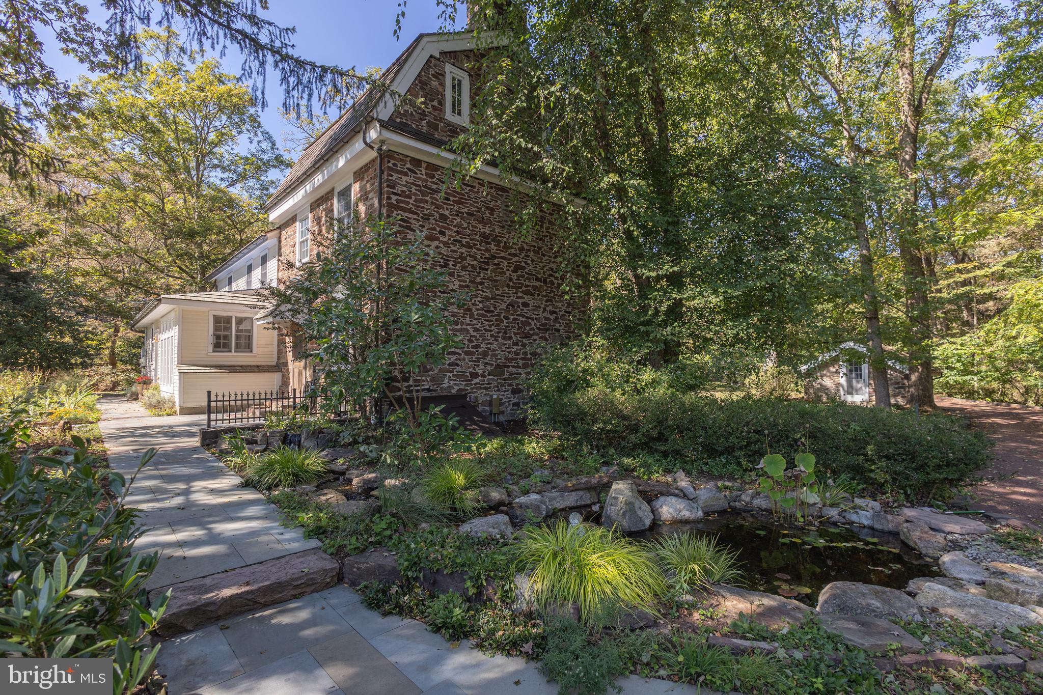 928 Taylorsville Road Washington Crossing, PA 18977 - Photo 76 of 106 a view of a house with a yard and sitting area