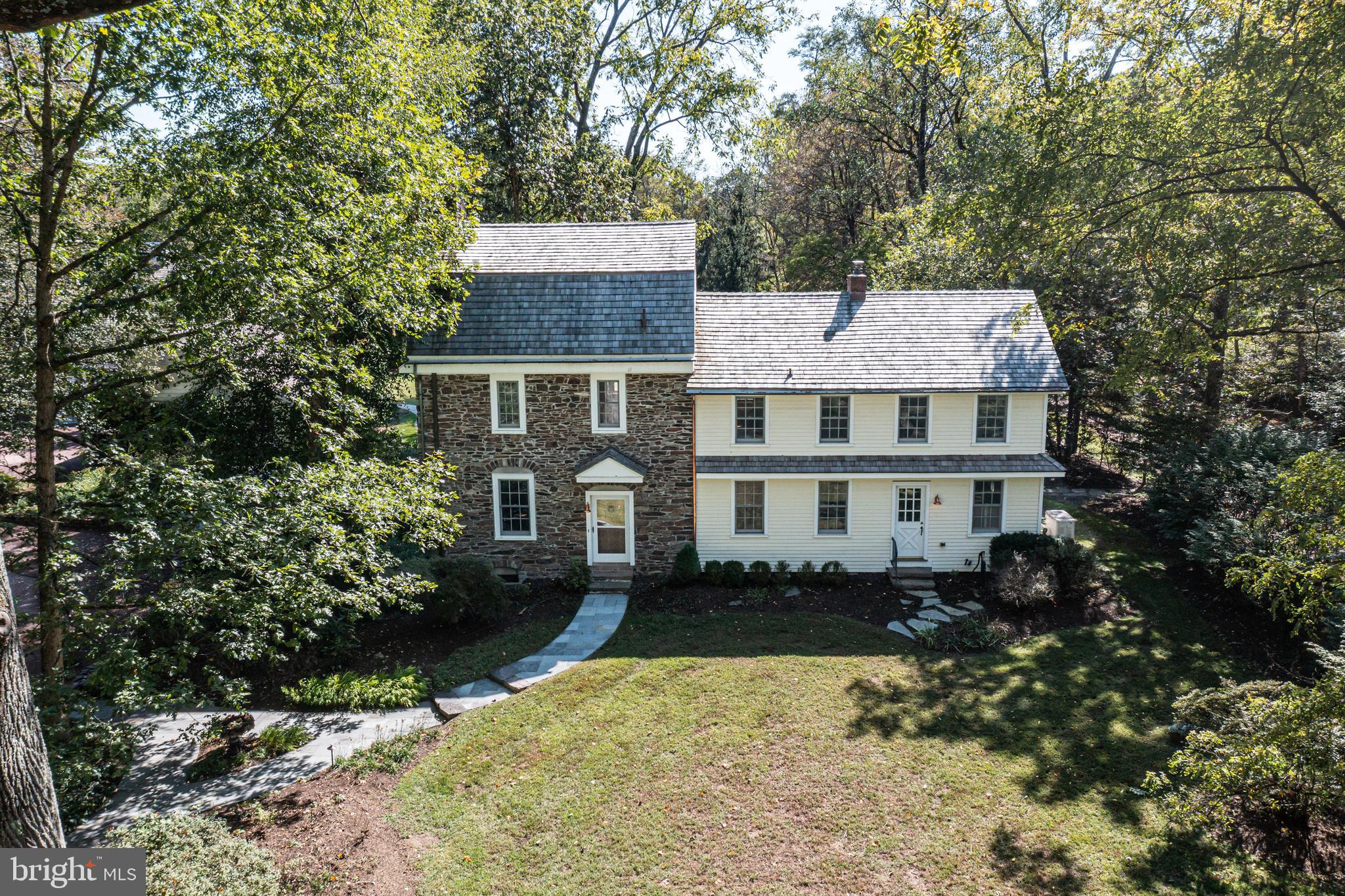 928 Taylorsville Road Washington Crossing, PA 18977 - Photo 93 of 106 a front view of a house with a yard and trees