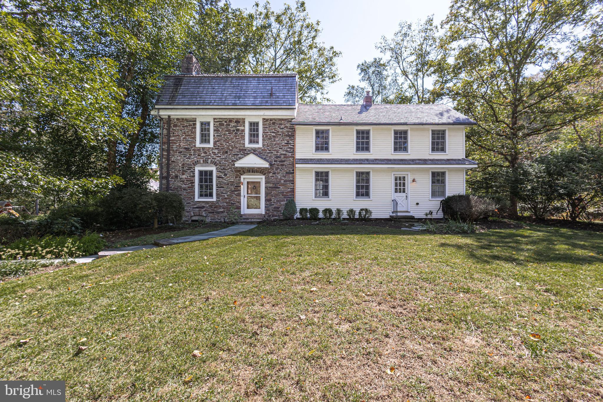 928 Taylorsville Road Washington Crossing, PA 18977 - Photo 10 of 106 a front view of a house with swimming pool and trees