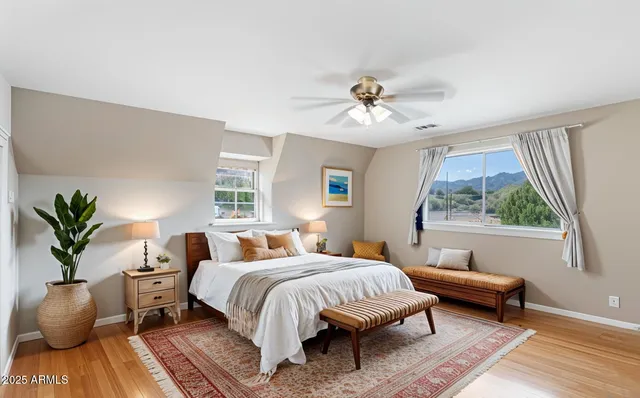 a bedroom with a large bed and a window