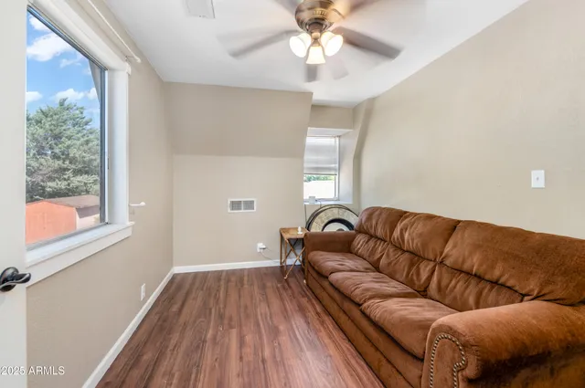 a living room with a couch and a bookshelf