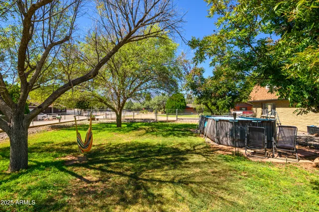 an aerial view of residential houses with outdoor space and street view