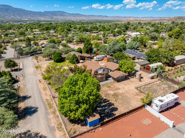 a view of a terrace with lawn chairs