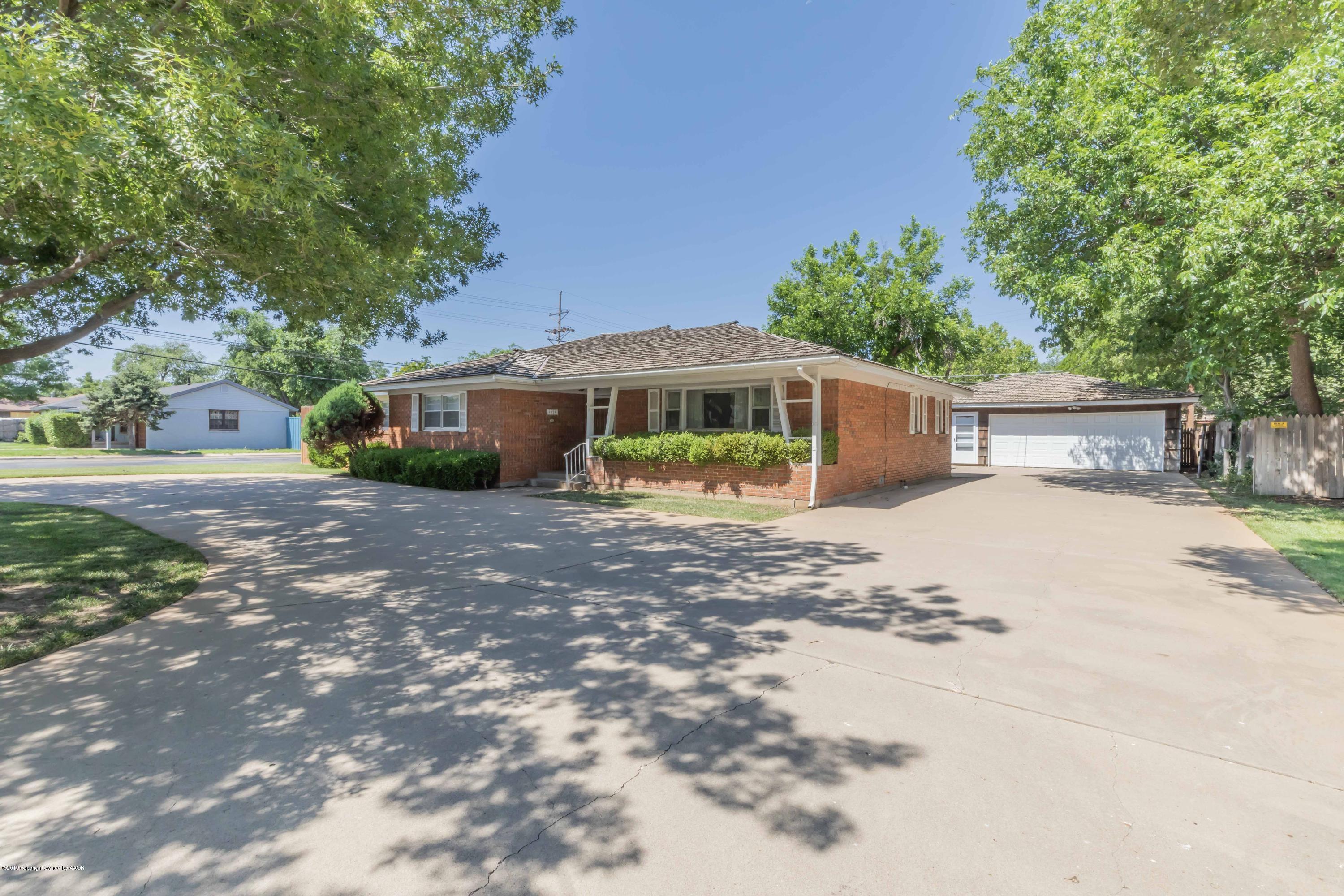 3228 South Travis Street Amarillo, TX 79109 - Photo 2 of 44 a view of a house with a yard