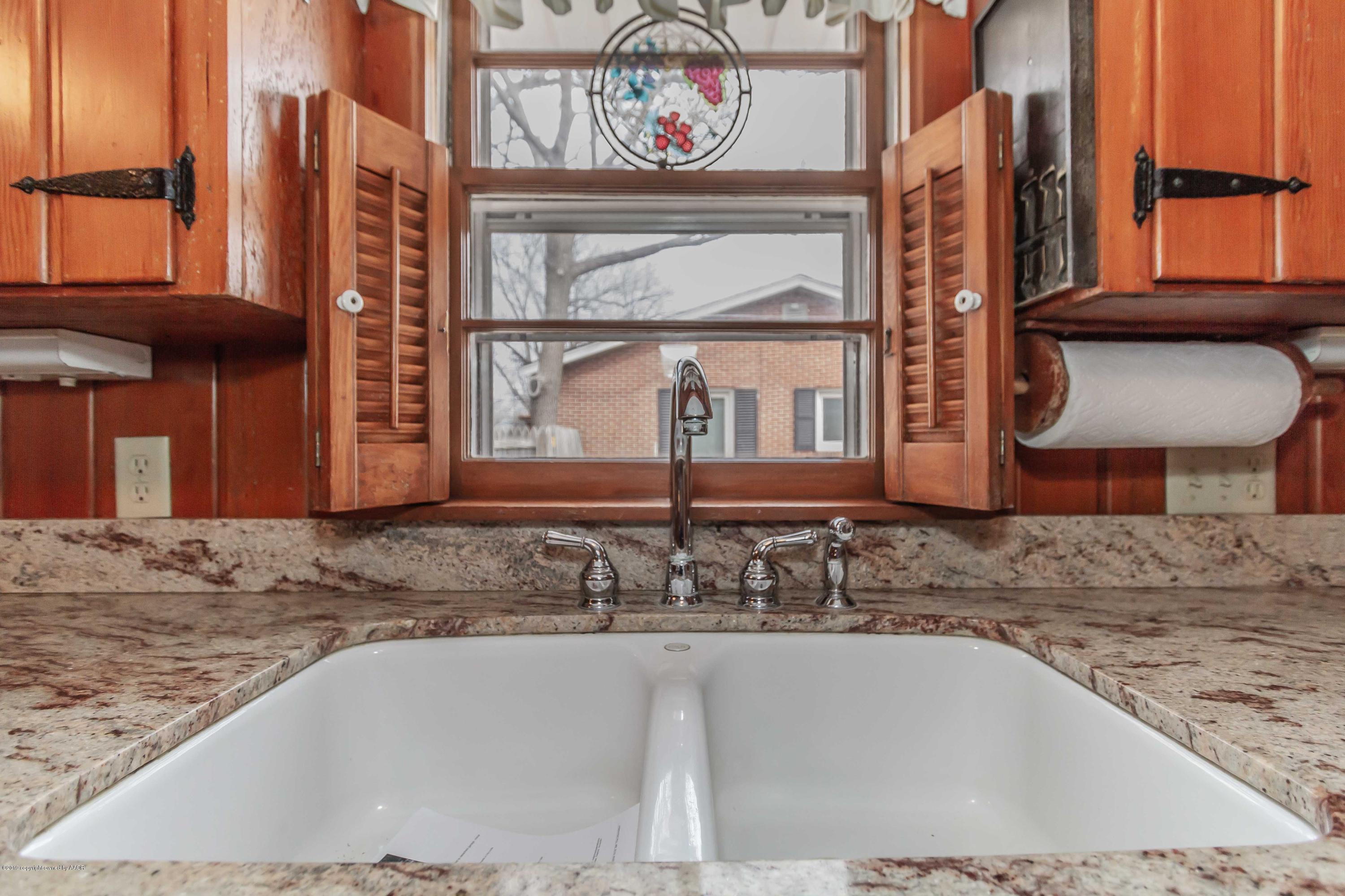3228 South Travis Street Amarillo, TX 79109 - Photo 11 of 44 a view of a house with a sink and a window