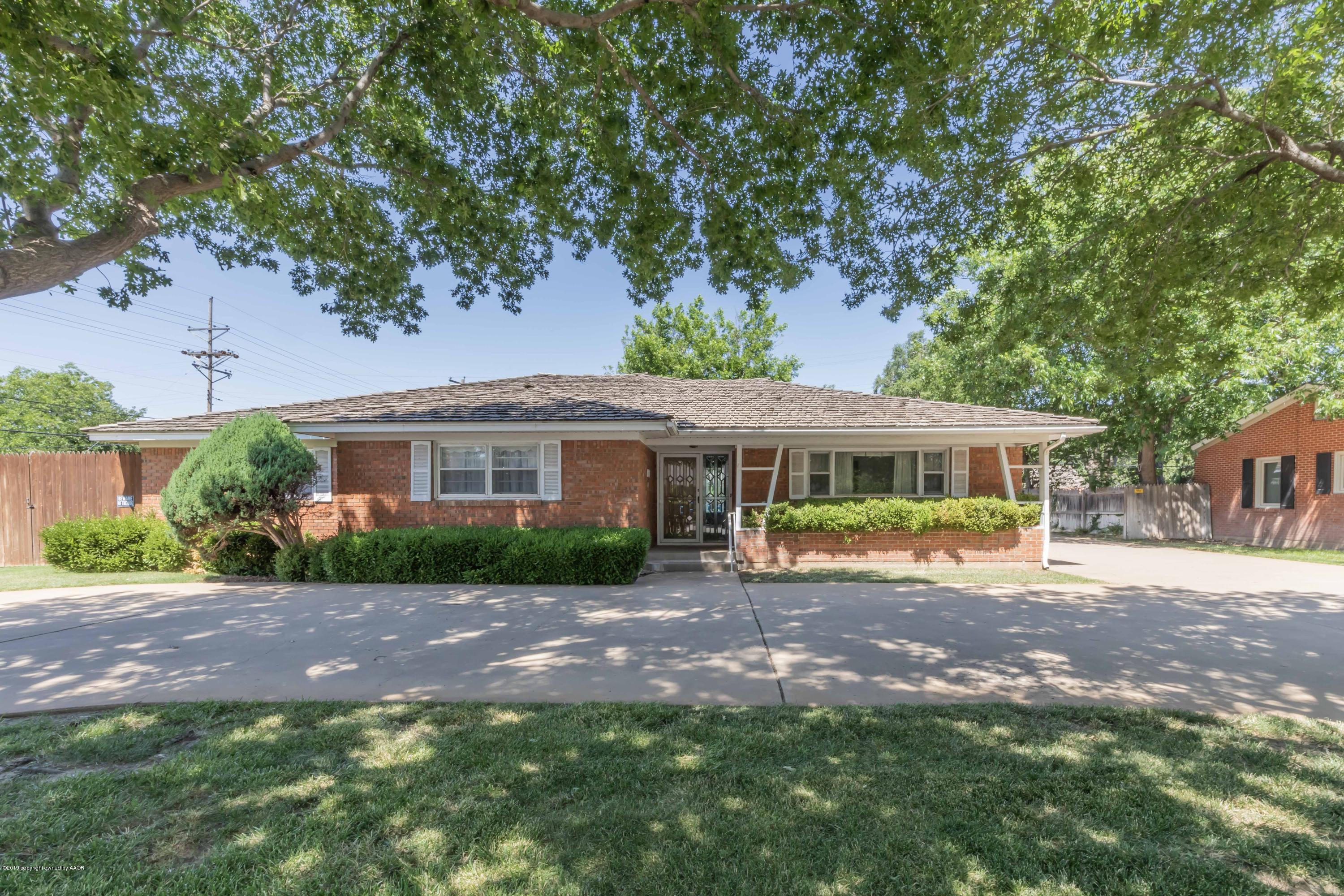 3228 South Travis Street Amarillo, TX 79109 - Photo 44 of 44 a view of a house with a yard