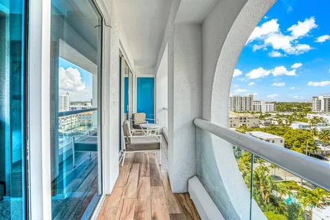 a view of balcony with wooden floor