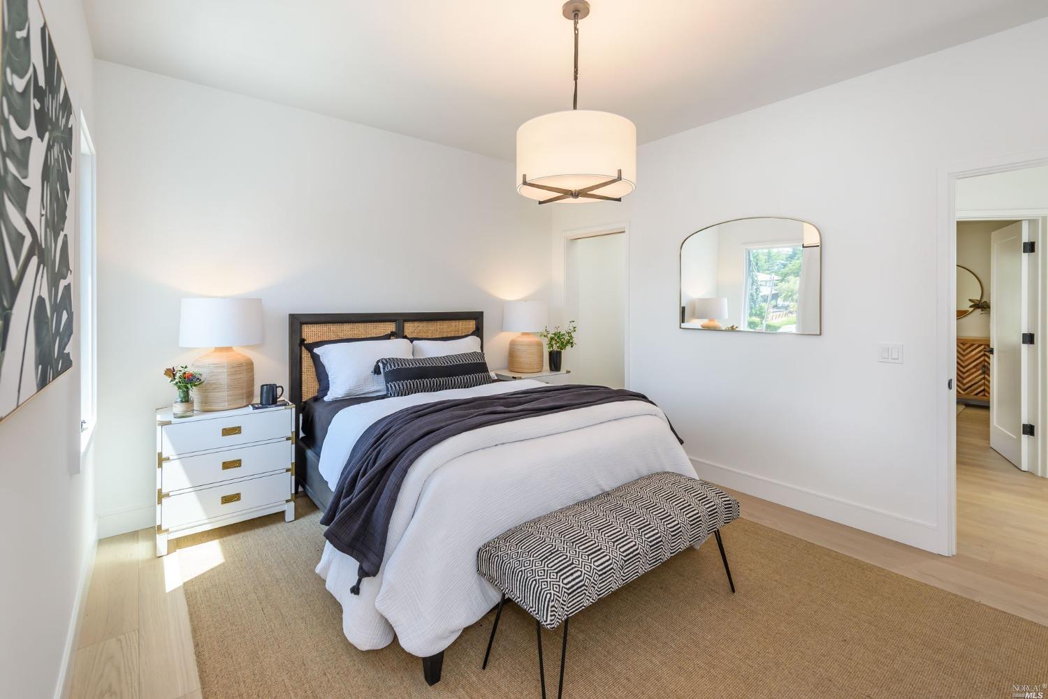 1072 Foster Road Napa, CA 94558 - Photo 14 of 28 a bedroom with a bed and chandelier