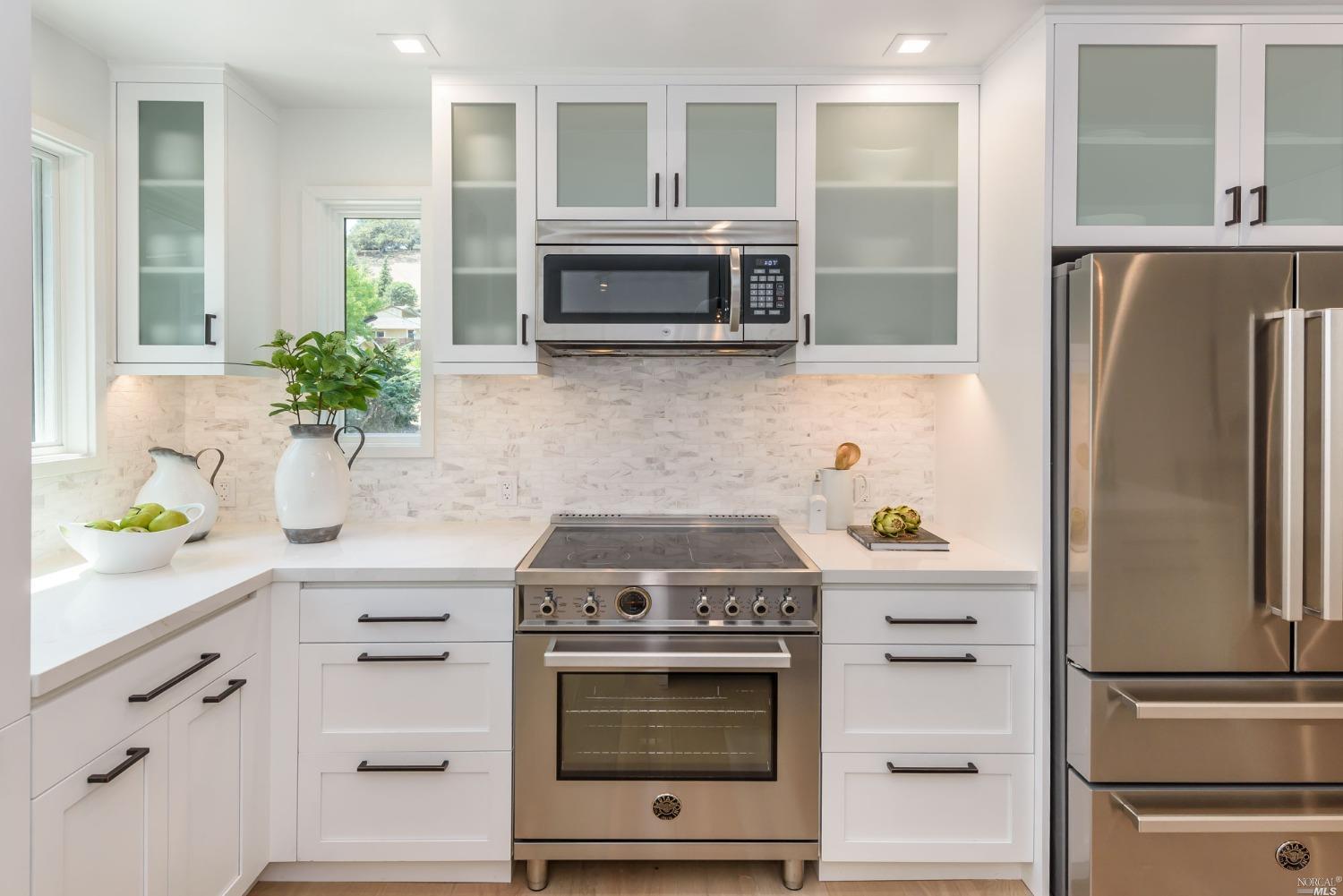 1072 Foster Road Napa, CA 94558 - Photo 7 of 28 a kitchen with stainless steel appliances white cabinets and a stove