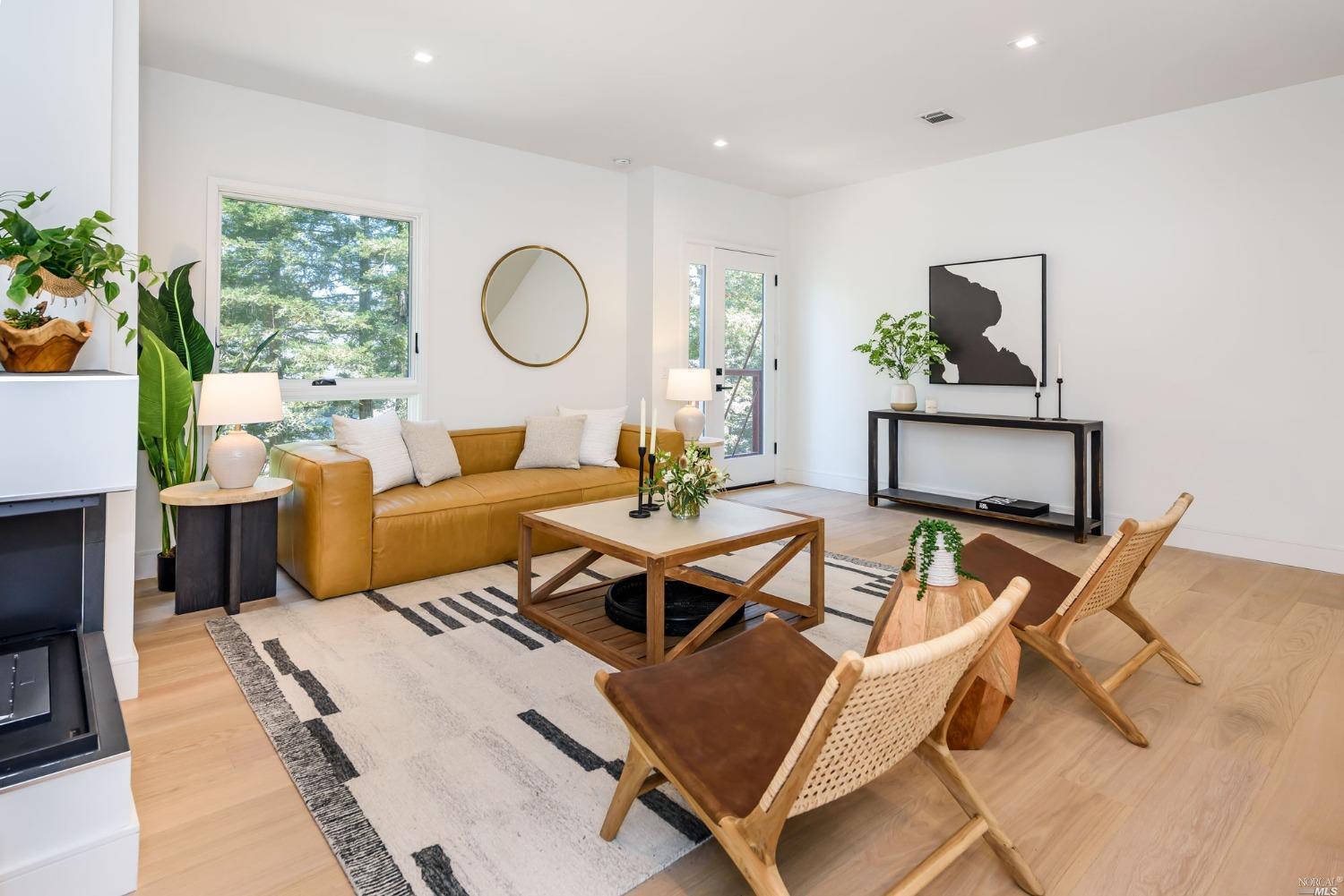 1072 Foster Road Napa, CA 94558 - Photo 10 of 28 a living room with furniture a rug potted plant and a window