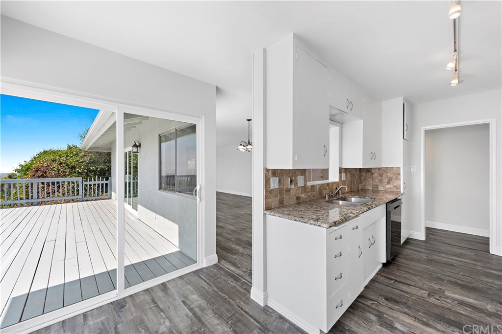 2809 Chillon Way Laguna Beach, CA 92651 - Photo 12 of 32 a bathroom with a sink and a large mirror