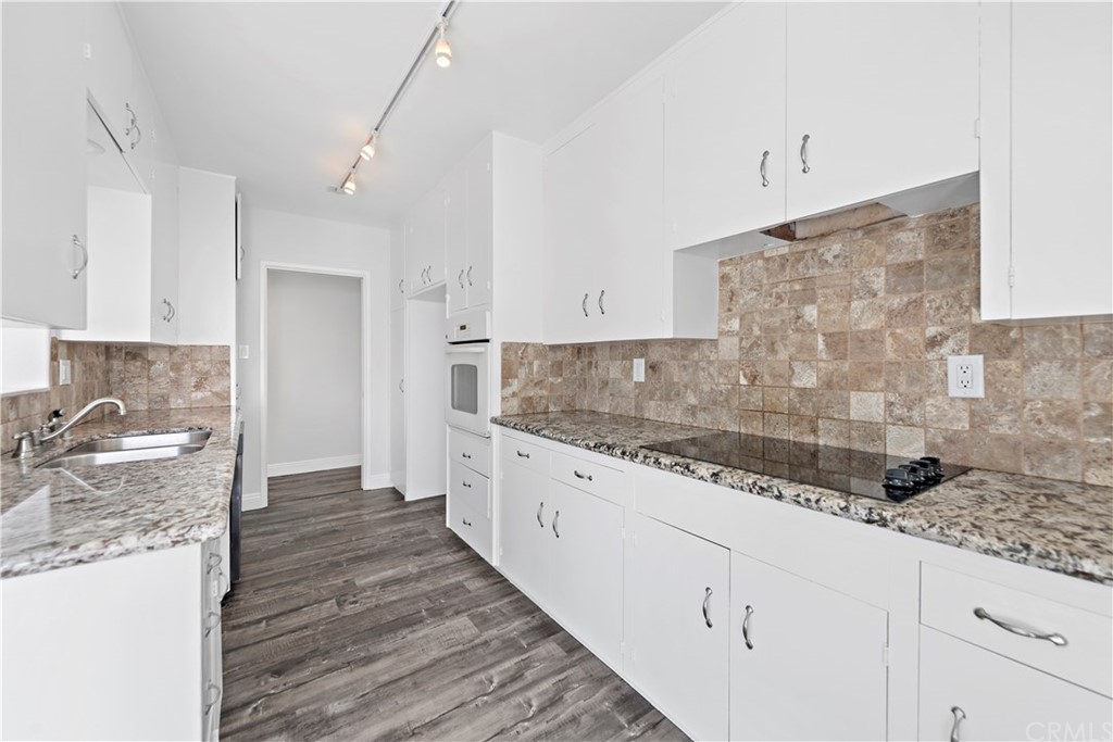 2809 Chillon Way Laguna Beach, CA 92651 - Photo 13 of 32 a large kitchen with granite countertop a sink and a stove