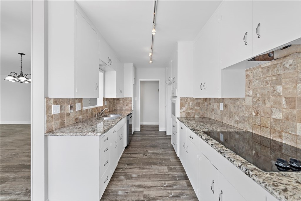 2809 Chillon Way Laguna Beach, CA 92651 - Photo 14 of 32 a large kitchen with granite countertop a sink and cabinets