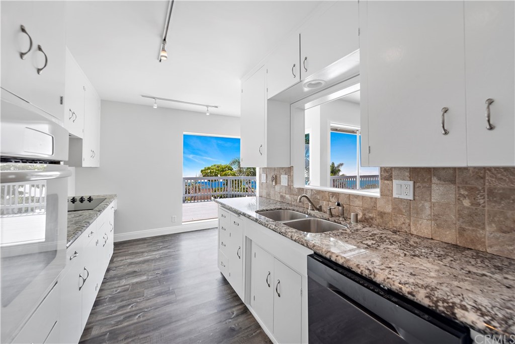 2809 Chillon Way Laguna Beach, CA 92651 - Photo 16 of 32 a kitchen with stainless steel appliances granite countertop a sink stove and cabinets