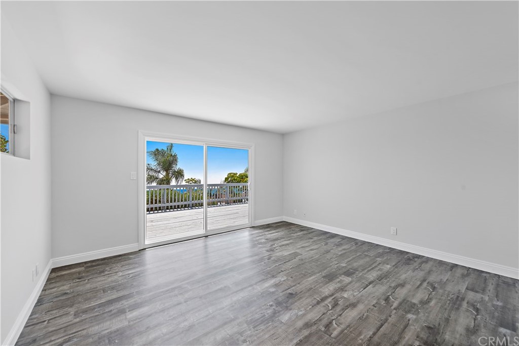 2809 Chillon Way Laguna Beach, CA 92651 - Photo 17 of 32 an empty room with wooden floor and windows