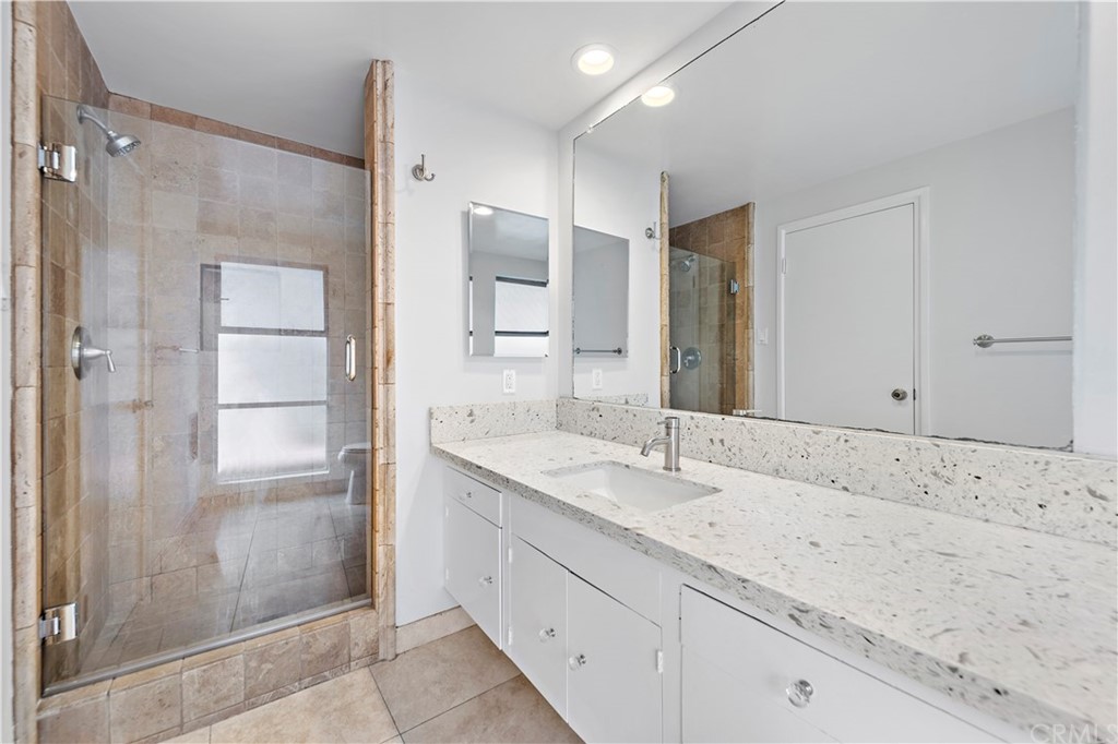 2809 Chillon Way Laguna Beach, CA 92651 - Photo 20 of 32 a bathroom with a granite countertop sink mirror and shower