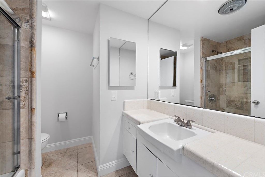 2809 Chillon Way Laguna Beach, CA 92651 - Photo 23 of 32 a bathroom with a sink and a mirror