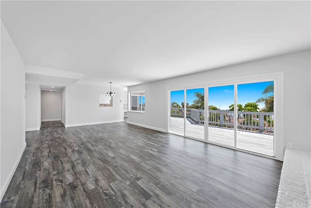 2809 Chillon Way Laguna Beach, CA 92651 - Photo 8 of 32 a view of an empty room with wooden floor and a window
