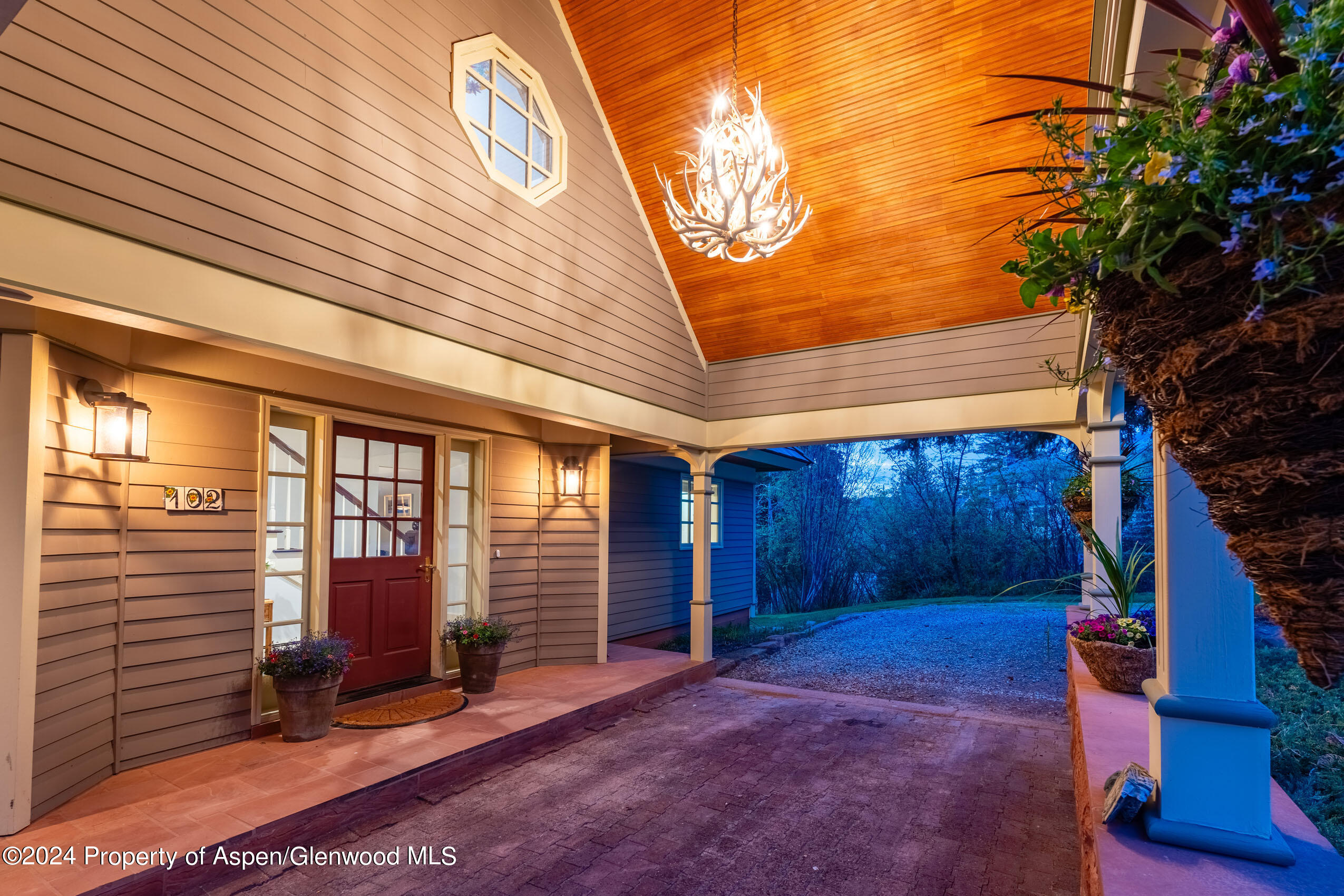 102 Firehouse Road Redstone, CO 81623 - Photo 14 of 50 a view of a backyard with large trees and wooden fence