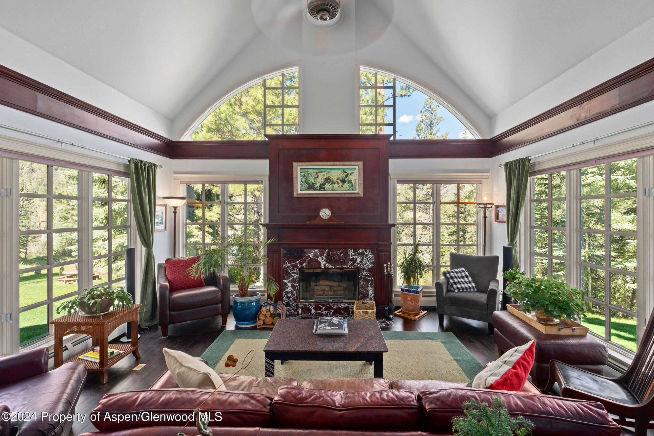 102 Firehouse Road Redstone, CO 81623 - Photo 17 of 50 a living room with furniture a fireplace and floor to ceiling windows