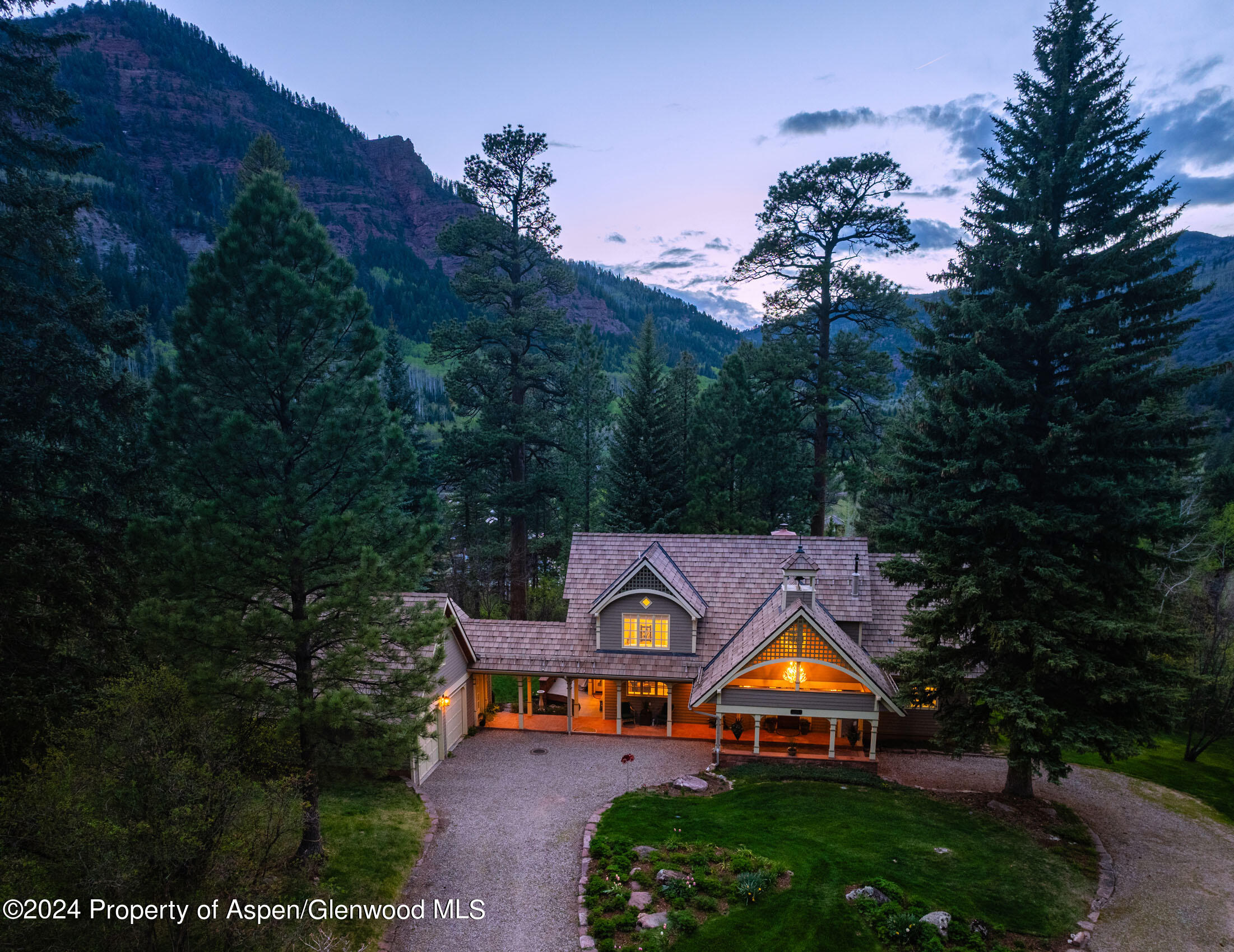 102 Firehouse Road Redstone, CO 81623 - Photo 4 of 50 a view of a big house with a big yard and large trees