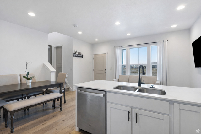 3473 Hardman Way Lehi, UT 84048 - Photo 6 of 22 Kitchen with dishwasher, light wood-style floors, white cabinets, recessed lighting, and light stone counters