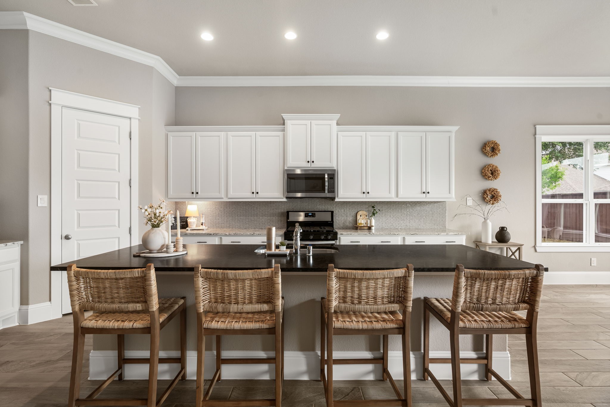 2206 Rope Maker Road Conroe, TX 77384 - Photo 22 of 42 Oversized island with ample seating anchors this beautifully designed gourmet kitchen.