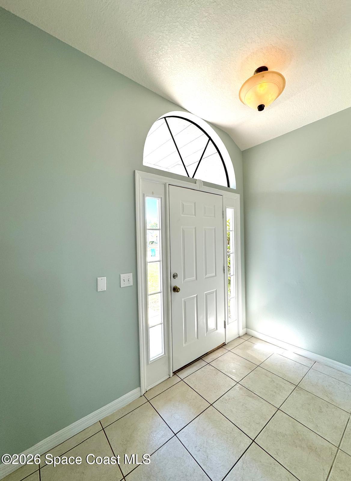 2168 Misty Way Lane Melbourne, FL 32935 - Photo 12 of 19 a view of an entryway with wooden floor