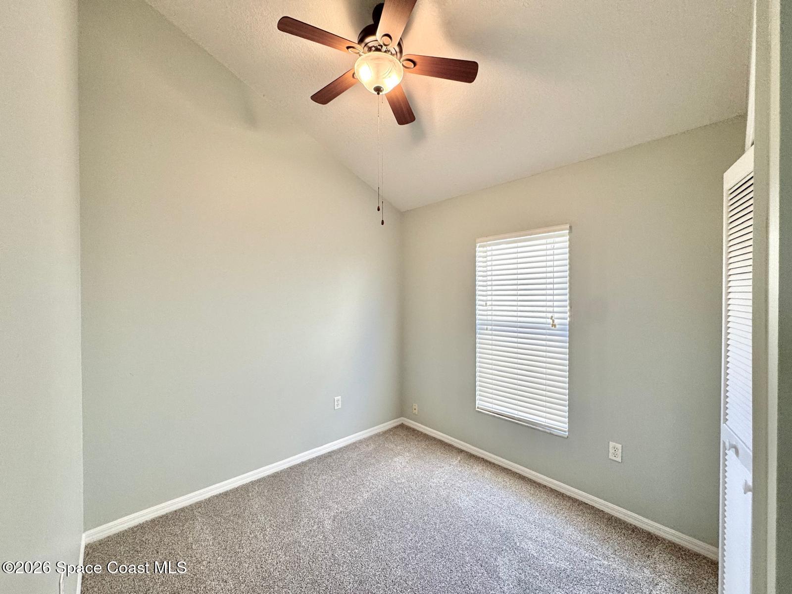2168 Misty Way Lane Melbourne, FL 32935 - Photo 14 of 19 a view of an empty room with a window