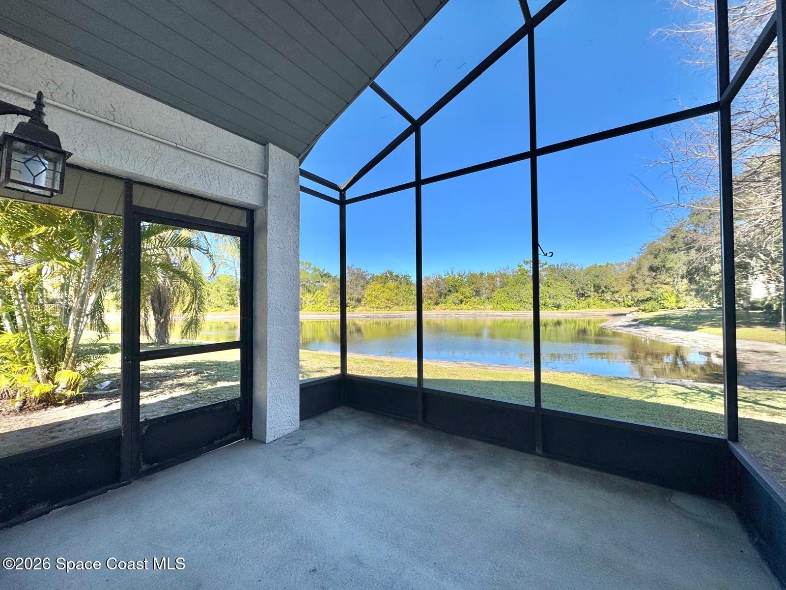 2168 Misty Way Lane Melbourne, FL 32935 - Photo 16 of 19 a view of an empty room with large windows