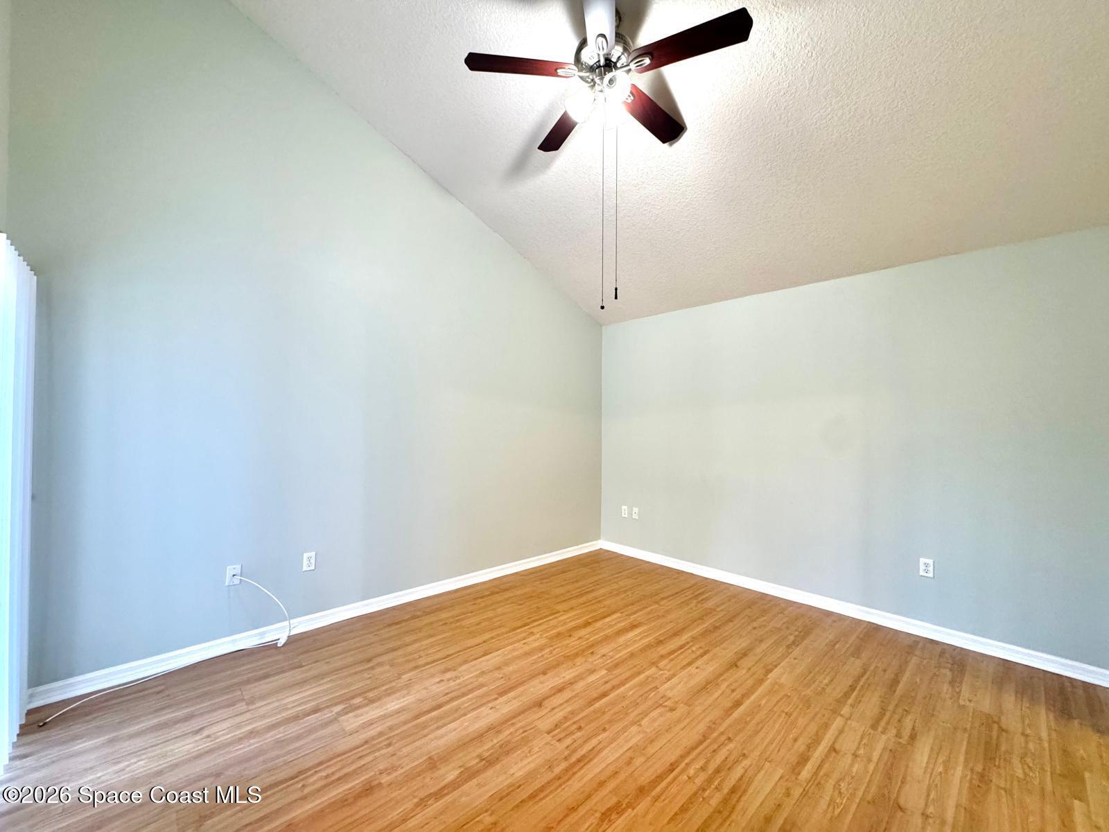 2168 Misty Way Lane Melbourne, FL 32935 - Photo 8 of 19 a view of a big room with wooden floor