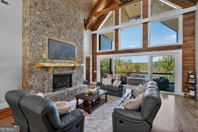 a bathroom with a granite countertop sink mirror vanity and toilet