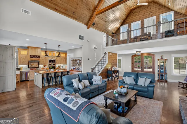 a view of a patio with a table chairs and a backyard