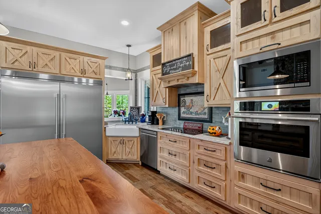 a room with a bed and wooden floor