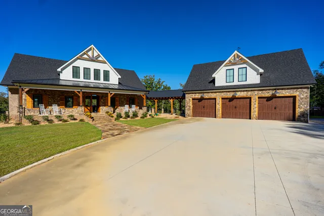 a view of a porch with a table and chairs