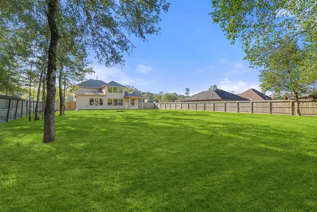 a view of a house with a big yard