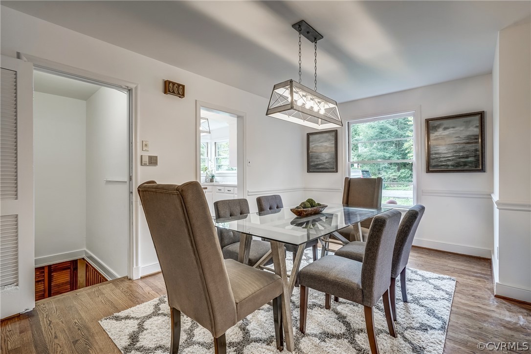 1606 Princeton Road Richmond, VA 23227 - Photo 7 of 37 a view of a dining room with furniture window and wooden floor