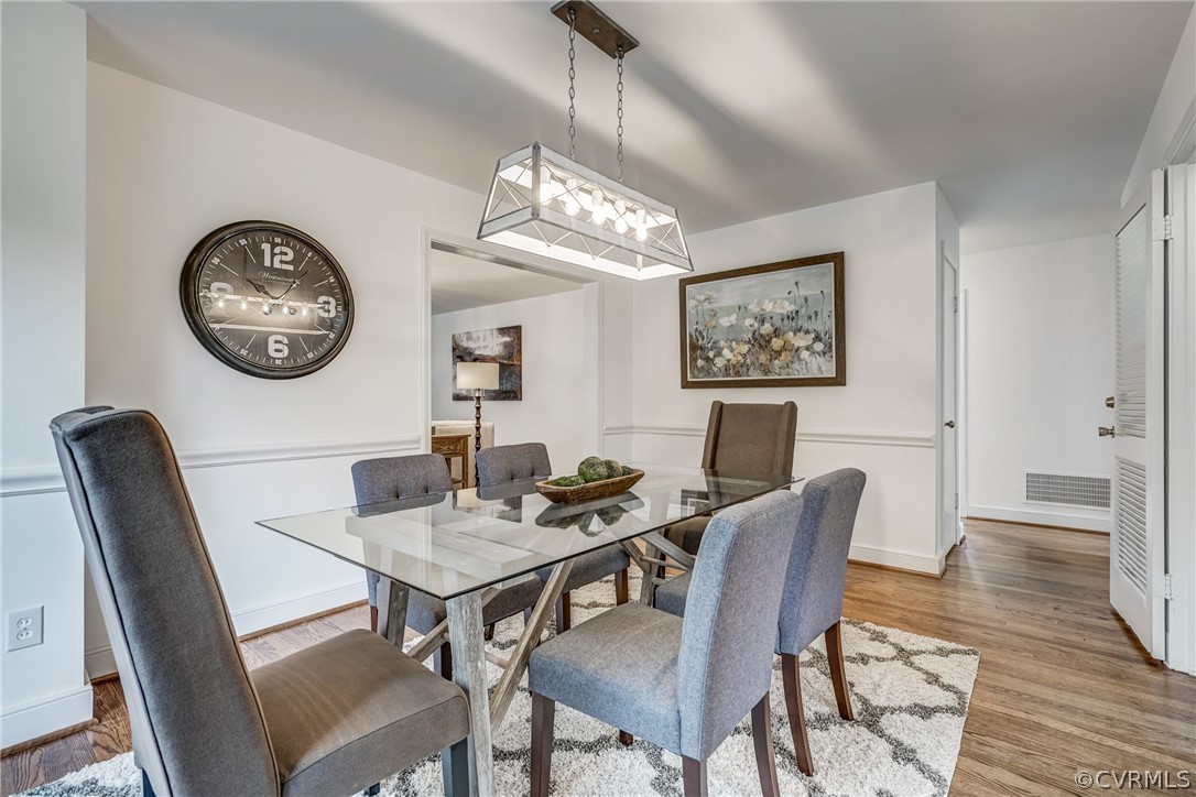 1606 Princeton Road Richmond, VA 23227 - Photo 8 of 37 a view of a dining room with furniture wooden floor and a chandelier