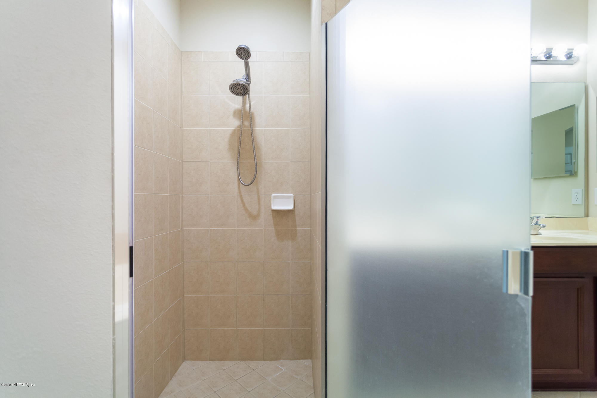 3256 Chestnut Ridge Way Orange Park, FL 32065 - Photo 12 of 39 a bathroom with a shower