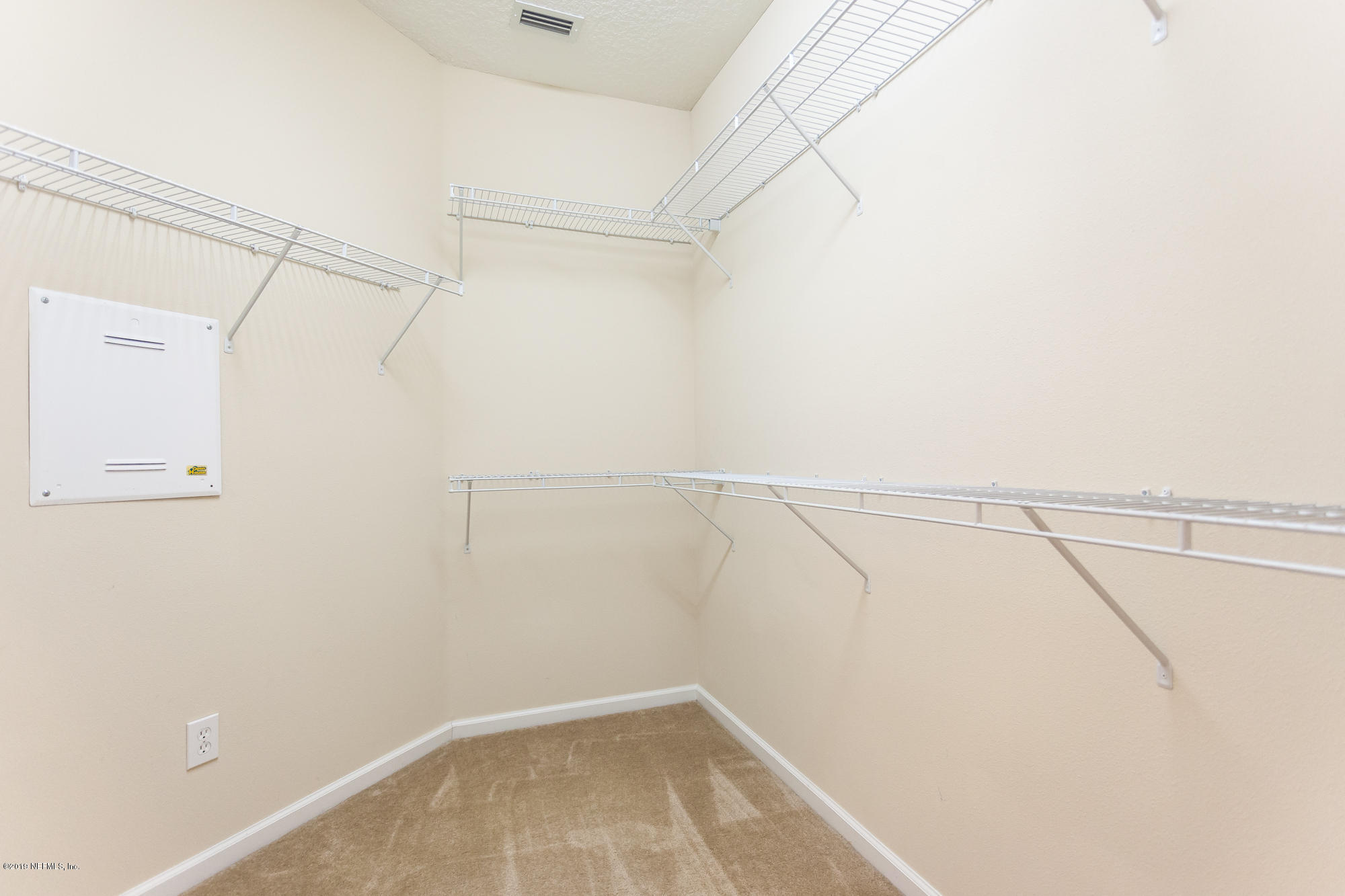 3256 Chestnut Ridge Way Orange Park, FL 32065 - Photo 15 of 39 a view of a room with racks on the wall