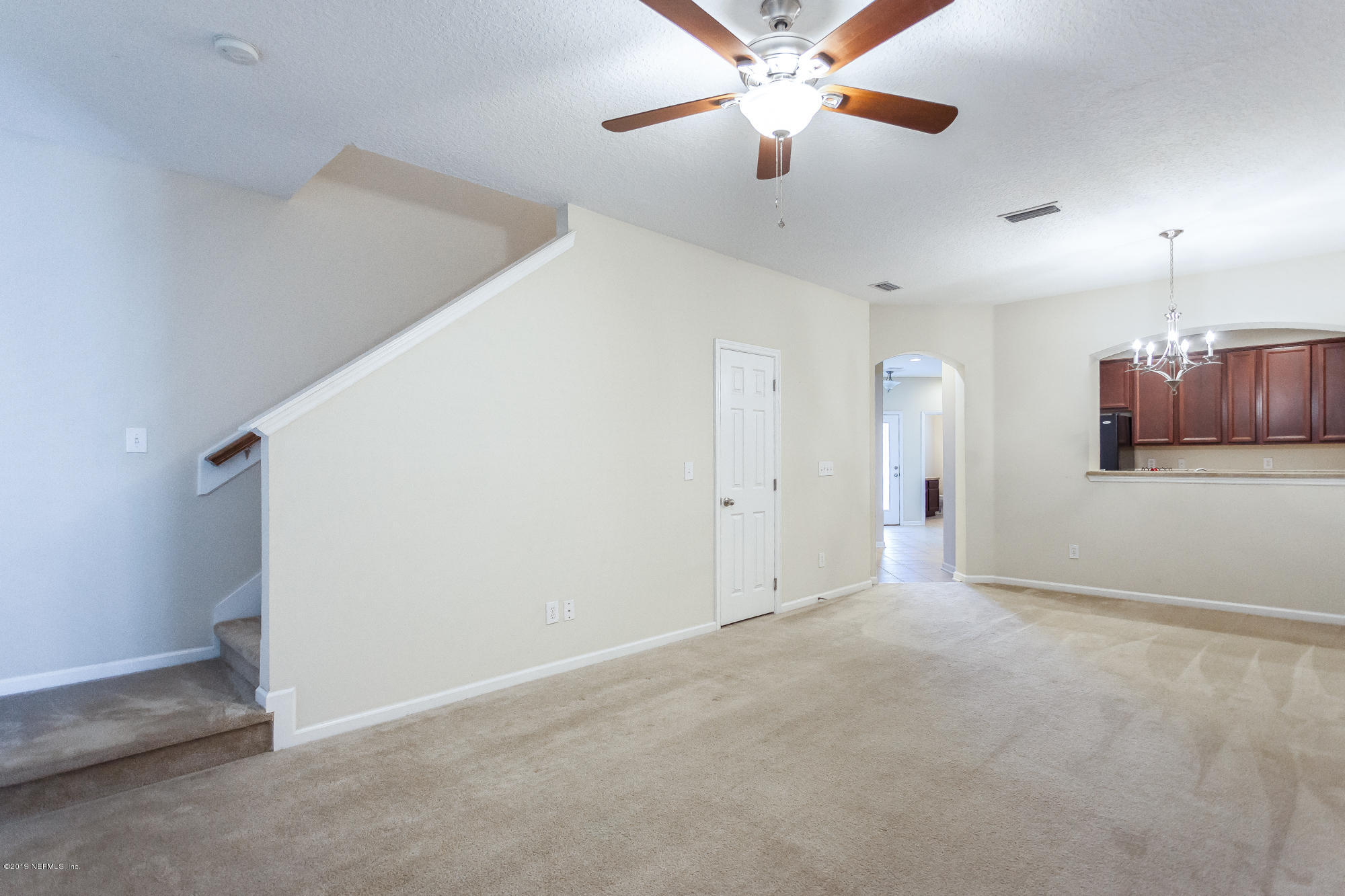 3256 Chestnut Ridge Way Orange Park, FL 32065 - Photo 16 of 39 en empty room with ceiling fan and window