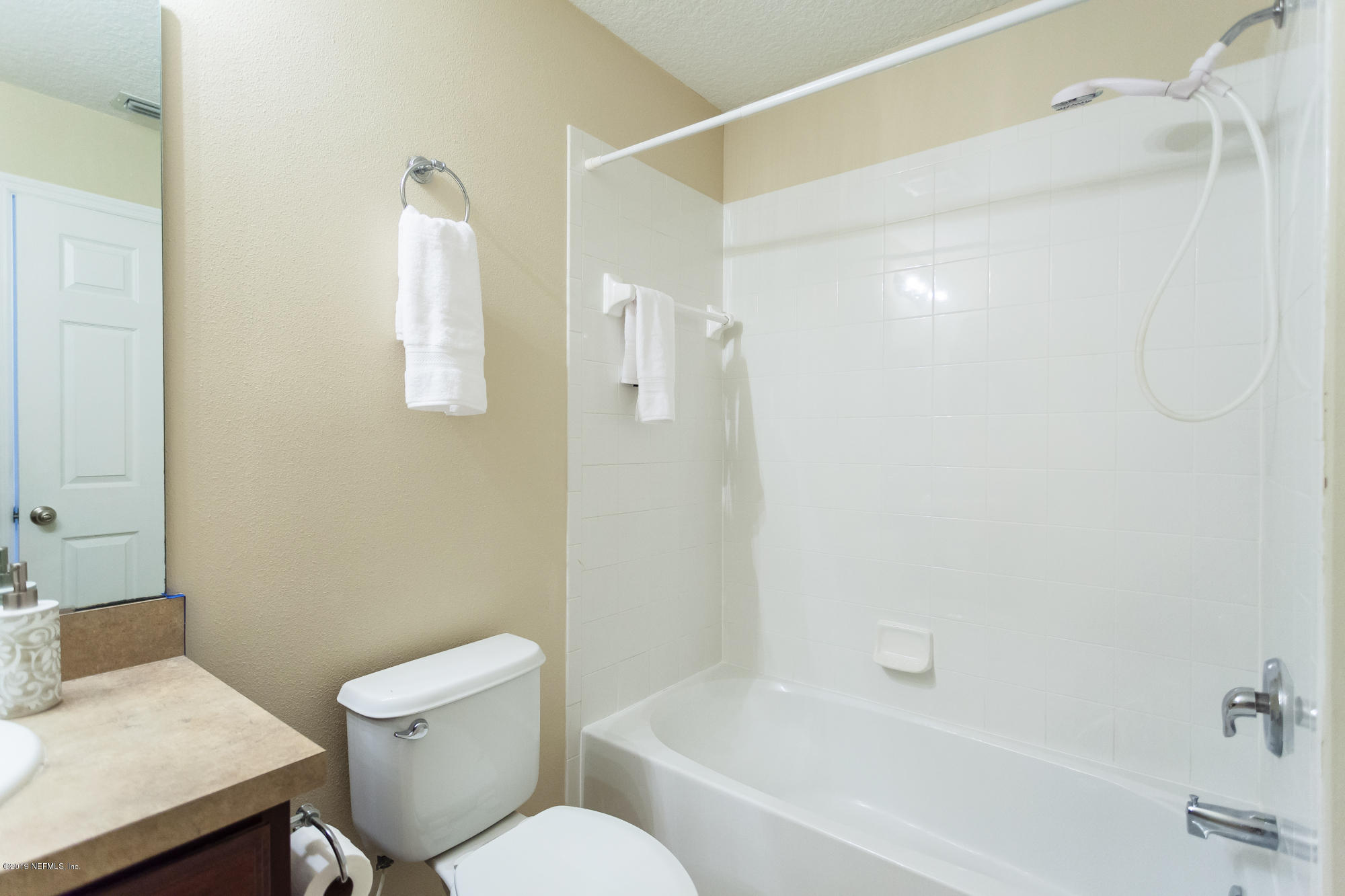 3256 Chestnut Ridge Way Orange Park, FL 32065 - Photo 24 of 39 a white toilet sitting next to a bath tub