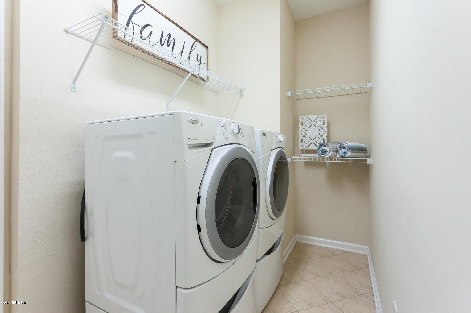 3256 Chestnut Ridge Way Orange Park, FL 32065 - Photo 25 of 39 a utility room with dryer and washer
