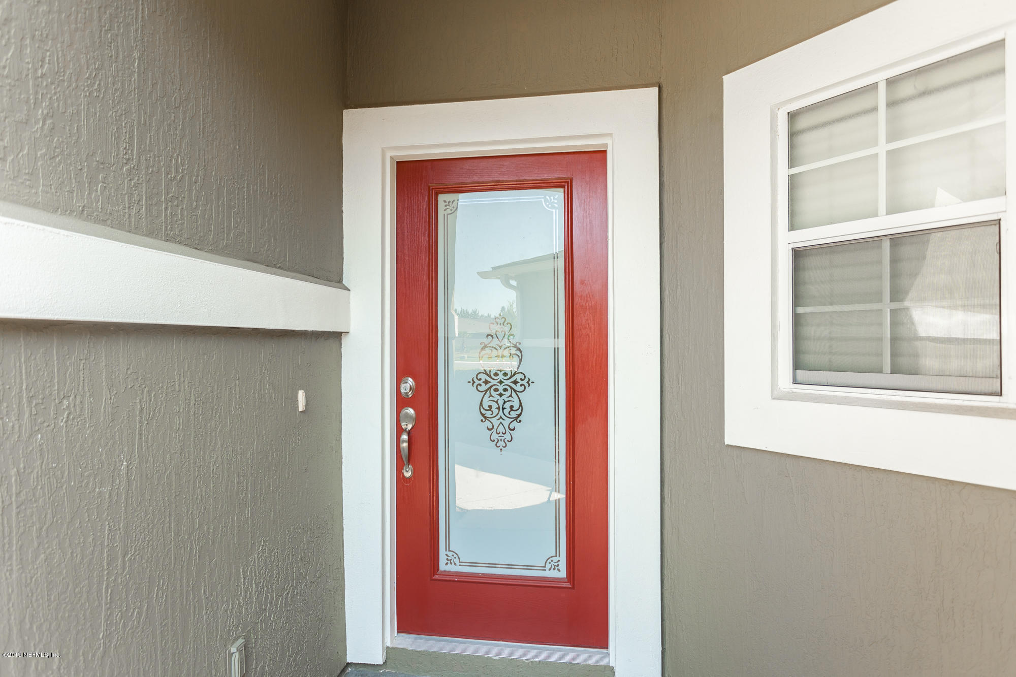 3256 Chestnut Ridge Way Orange Park, FL 32065 - Photo 3 of 39 a view of a hallway with windows