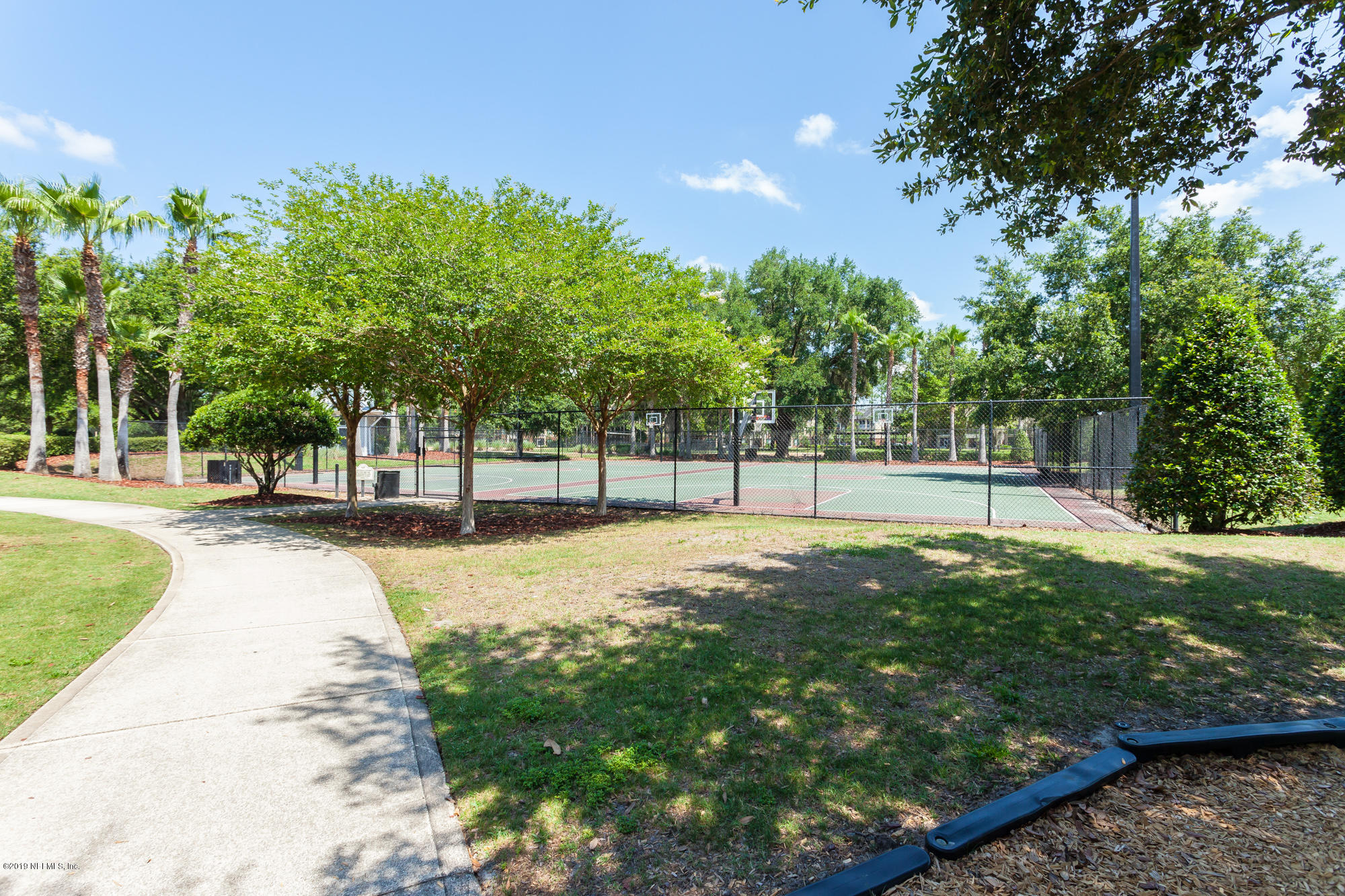 3256 Chestnut Ridge Way Orange Park, FL 32065 - Photo 38 of 39 a view of a playground with basketball court
