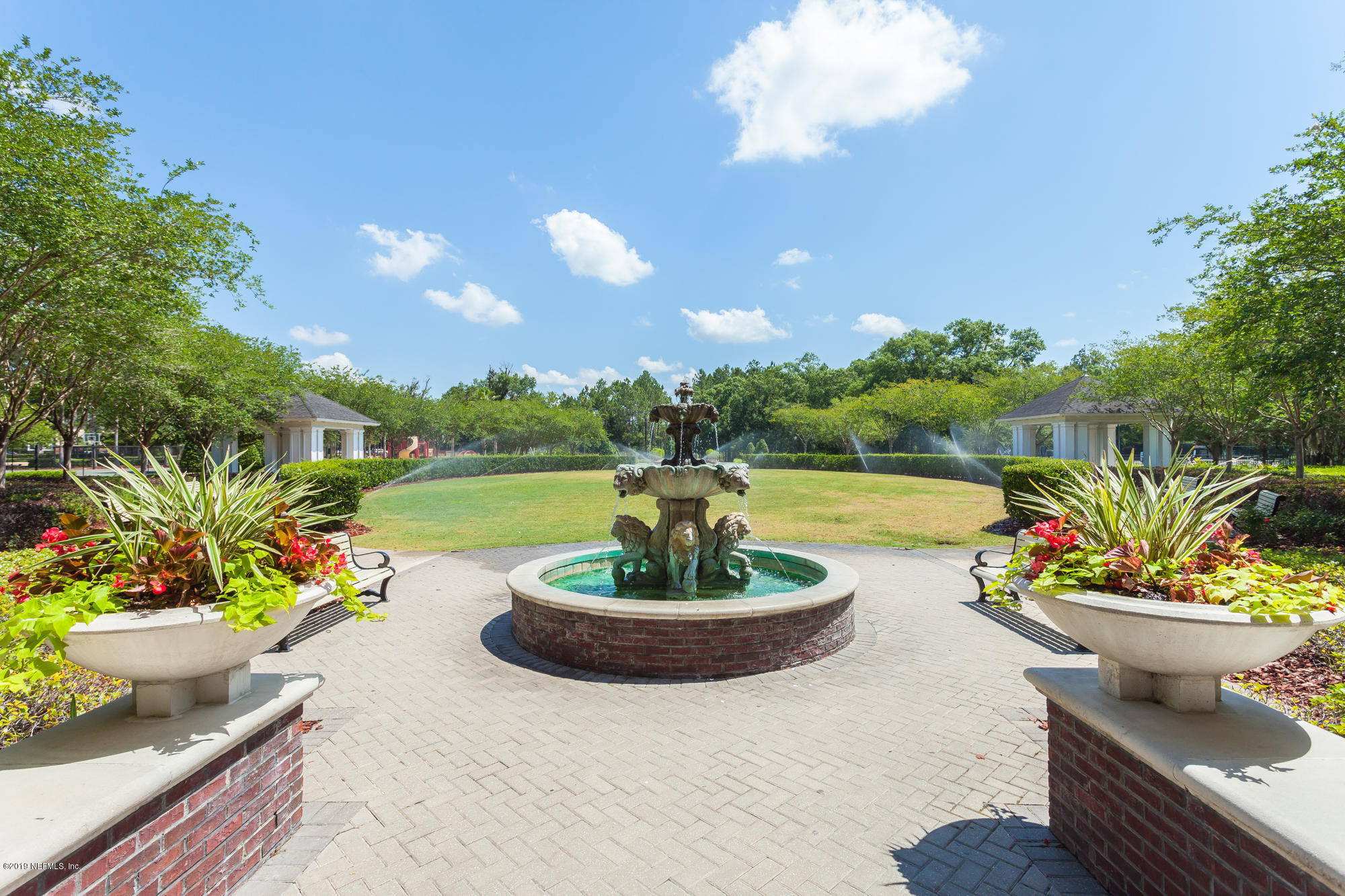 3256 Chestnut Ridge Way Orange Park, FL 32065 - Photo 39 of 39 a swimming pool with potted plants and a garden