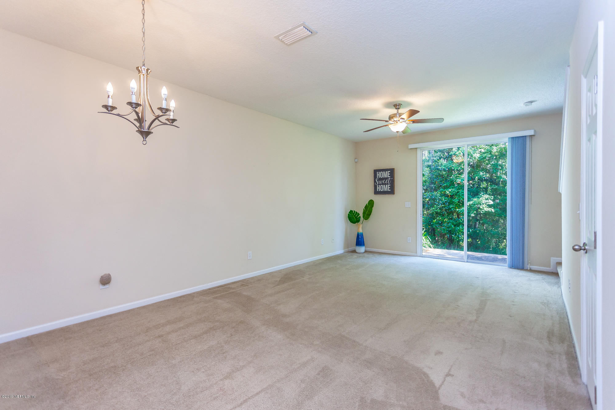 3256 Chestnut Ridge Way Orange Park, FL 32065 - Photo 7 of 39 a view of an empty room with a window