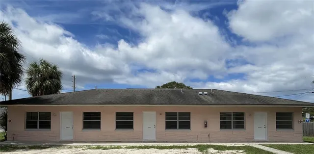 a kitchen with stainless steel appliances a refrigerator sink cabinets and a window