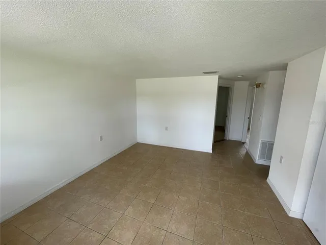 an empty room with an entrance door